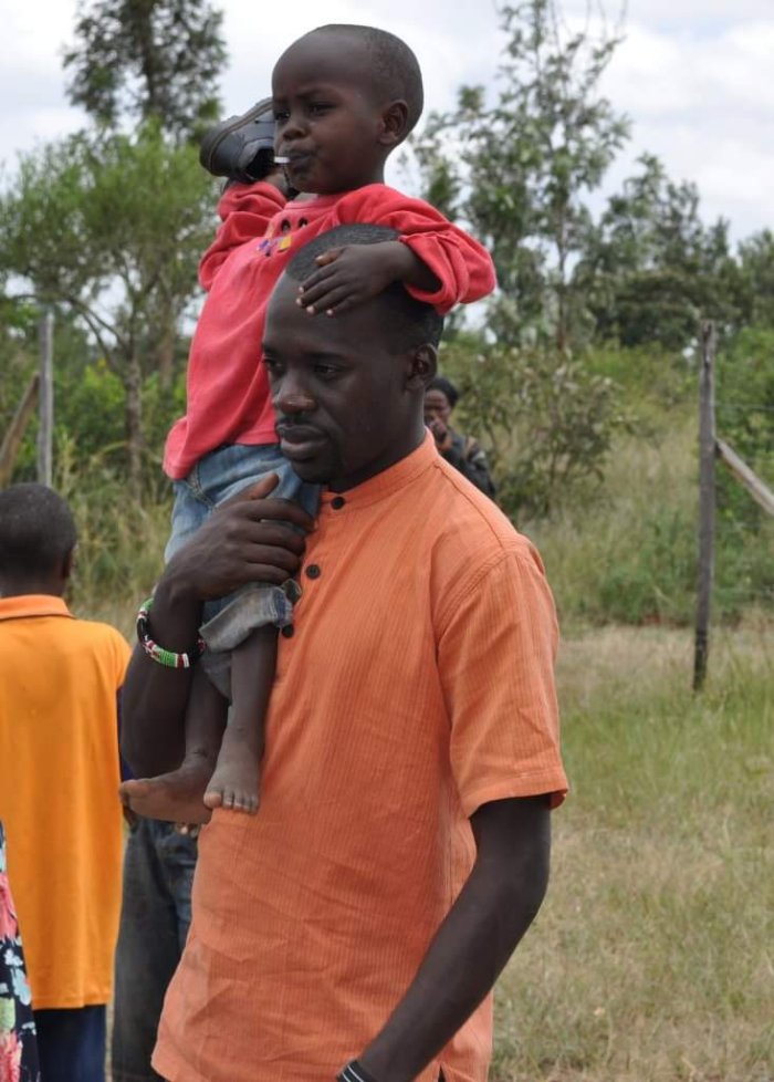 Haron Owalo with young people from the community